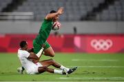 26 July 2021; Jordan Conroy of Ireland is tackled by Perry Baker of USA during the rugby sevens men's pool C match between Ireland and USA at the Tokyo Stadium during the 2020 Tokyo Summer Olympic Games in Tokyo, Japan. Photo by Stephen McCarthy/Sportsfile