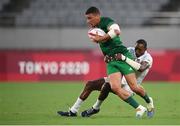 26 July 2021; Jordan Conroy of Ireland in action against Perry Baker of United States during the rugby sevens men's pool C match between Ireland and USA at the Tokyo Stadium during the 2020 Tokyo Summer Olympic Games in Tokyo, Japan. Photo by Stephen McCarthy/Sportsfile