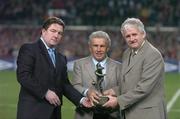 18 February 2004; Johnny Giles is presented with the Best International player award by Fran Rooney, left, Chief Executive FAI, and Milo Corcoran, right, President FAI, at half time. International Friendly, Republic of Ireland v Brazil, Lansdowne Road. Dublin. Picture credit; David Maher / SPORTSFILE *EDI*