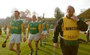 15 February 2004; Sean McLean, right, Dunloy manager,  walks with his team during the parade before the start of the game. AIB All-Ireland Club Senior Hurling Championship Semi-Final, Portumna v Dunloy, St. Tighernach's Park, Clones, Co. Monaghan. Picture credit; David Maher / SPORTSFILE *EDI*