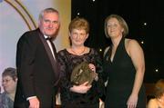28 February 2004; Mary Fennelly, on behalf of Angela Downey Browne, Kilkenny, who was named on the Camogie team of the Century, with An Taoiseach, Bertie Ahern, TD, and Miriam O'Callaghan, Uachtaran, Cumann Camogaiochta na nGael, at the Cumann Camogaiochta na nGael centenary celebrations at the Citywest Hotel, Dublin. Picture credit; Ray McManus / SPORTSFILE *EDI*