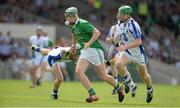 14 July 2013; Ronan Lynch, Limerick, in action against William Hahessy, left, and Tom Devine, Waterford. Electric Ireland Munster GAA Hurling Minor Championship Final, Waterford v Limerick, Gaelic Grounds, Limerick. Picture credit: Diarmuid Greene / SPORTSFILE