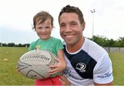 17 July 2013; Leinster's Isaac Boss with Jessica Manek, age 3, from Delganey, Co. Wicklow, during a Leinster Rugby summer camp. Greystones RFC Summer Camp, Greystones RFC, Co. Wicklow. Picture credit: Barry Cregg / SPORTSFILE
