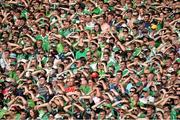 14 July 2013; Supporters shield their eyes from the sun during the game. Munster GAA Hurling Senior Championship Final, Limerick v Cork, Gaelic Grounds, Limerick. Picture credit: Diarmuid Greene / SPORTSFILE