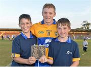 18 July 2013; Podge Collins, Clare, is presented with the Man of the Match award by Shane Whelan, age 12, from Ennis, Co. Clare, left, and Darragh Whelan, age 10, from Newmarket-On-Fergus, Co. Clare. Bord Gáis Energy Munster GAA Hurling Under 21 Championship Semi-Final, Clare v Waterford, Walsh Park, Waterford. Picture credit: Brian Lawless / SPORTSFILE