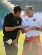 19 July 2013; Bohemians caretaker manager Owen Heary, right, and U19 manager Graham O'Hanlon look at the team-sheets before the start of the game. Airtricity League Premier Division, Bray Wanderers v Bohemians, Carlisle Grounds, Bray, Co. Wicklow. Picture credit: David Maher / SPORTSFILE