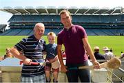 20 July 2013; Former Waterford hurling star Ken McGrath was the latest to feature on the Bord Gáis Energy Legends Tour Series 2013 and he gave a unique tour of the Croke Park stadium and facilities. Pictured on the tour with Ken are, Bob Donnelly and Zack, five years, from Newtown Donore, Co Kildare. Other greats of the game still to feature this Summer on the Bord Gáis Energy Legends Tour Series include Steven McDonnell, Seán McGrath, Pat Gilroy and Noel Skehan. Full details and dates for the Bord Gáis Energy Legends Tour Series 2013 are available on www.crokepark.ie/events. Croke Park, Dublin. Picture credit: Ray McManus / SPORTSFILE