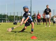 20 July 2013; Opel Kit for Clubs Ambassadors Michael Darragh Macauley, Ciaran Kilkenny and Jackie Tyrrell, supporting the Opel Kit for Clubs Blitz Day in Lucan Sarsfields GAA Club, Lucan. Kilkenny hurler Jackie Tyrrell watches Liam Kane, St. Judes GAA Club, during the shooting skills. For every test drive, car service or Opel purchase made through the Opel dealer network, your local GAA club is awarded points. Build up your points and redeem them against high quality kit for your club! Log onto opelkitforclubs.com http://opelkitforclubs.com and start earning points today. Support your local GAA club! Lucan Sarsfields GAA Club, Dublin. Picture credit: Pat Murphy / SPORTSFILE