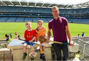 20 July 2013; Former Waterford hurling star Ken McGrath was the latest to feature on the Bord Gáis Energy Legends Tour Series 2013 and he gave a unique tour of the Croke Park stadium and facilities. Pictured on the tour with Ken are, Conall and Eoghan Criostoir, from Ring, Co. Waterford. Other greats of the game still to feature this Summer on the Bord Gáis Energy Legends Tour Series include Steven McDonnell, Seán McGrath, Pat Gilroy and Noel Skehan. Full details and dates for the Bord Gáis Energy Legends Tour Series 2013 are available on www.crokepark.ie/events. Croke Park, Dublin. Picture credit: Ray McManus / SPORTSFILE