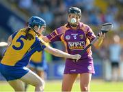 20 July 2013; Ursula Jabcob, Wexford, in action against Marie McGrath, Clare. Liberty Insurance Senior Camogie Championship Group 1, Wexford v Clare, Wexford Park, Wexford. Picture credit: David Maher / SPORTSFILE