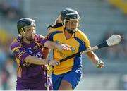 20 July 2013; Laura McMahon, Clare, in action against Ursula Jacob, Wexford. Liberty Insurance Senior Camogie Championship Group 1, Wexford v Clare, Wexford Park, Wexford. Picture credit: David Maher / SPORTSFILE