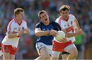 20 July 2013; Tomas Corr, Cavan, in action against Enda Lynn and Mark Lynch, right, Derry. GAA Football All-Ireland Senior Championship, Round 3, Derry v Cavan, Celtic Park, Derry. Picture credit: Oliver McVeigh / SPORTSFILE