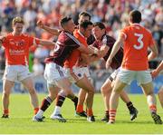 20 July 2013; Aaron Kernan, Armagh, in action against Danny Cummins and Michael Meehan, Galway. GAA Football All-Ireland Senior Championship, Round 3, Galway v Armagh, Pearse Stadium, Salthill, Galway. Picture credit: Ray Ryan / SPORTSFILE