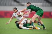 26 July 2021; Steve Tomasin of United States is tackled by Harry McNulty, left, and Terry Kennedy of Ireland during the rugby sevens men's pool C match between Ireland and USA at the Tokyo Stadium during the 2020 Tokyo Summer Olympic Games in Tokyo, Japan. Photo by Stephen McCarthy/Sportsfile