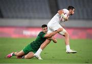 26 July 2021; Matt Thompson of United States is tackled by Bryan Mollen of Ireland during the rugby sevens men's pool C match between Ireland and USA at the Tokyo Stadium during the 2020 Tokyo Summer Olympic Games in Tokyo, Japan. Photo by Stephen McCarthy/Sportsfile
