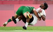 26 July 2021; Carlin Isles of United States is tackled by Jordan Conroy of Ireland during the rugby sevens men's pool C match between Ireland and USA at the Tokyo Stadium during the 2020 Tokyo Summer Olympic Games in Tokyo, Japan. Photo by Stephen McCarthy/Sportsfile