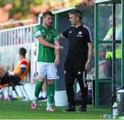 25 July 2021; Steven Beattie of Cork City with Cork City assistant manager Richie Holland as he leaves the field after picking up an injury during the FAI Cup First Round match between Sligo Rovers and Cork City at The Showgrounds in Sligo. Photo by Michael P Ryan/Sportsfile