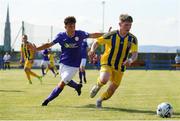 24 July 2021; Conor Coughlan of Fairview Rangers in action against Dan Hawkins of Finn Harps during the FAI Cup First Round match between Fairview Rangers and Finn Harps at Fairview Rangers AFC in Limerick. Photo by Michael P Ryan/Sportsfile