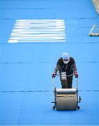 27 July 2021; A member of staff clears surface water from the track ahead of the Women's Triathlon at the Odaiba Marine Park during the 2020 Tokyo Summer Olympic Games in Tokyo, Japan. Photo by Stephen McCarthy/Sportsfile