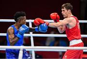 27 July 2021; Aidan Walsh of Ireland, right, in action against Albert Mengue Ayissi of Cameroon during the Men's Welterweight Round of 16 at the Kokugikan Arena during the 2020 Tokyo Summer Olympic Games in Tokyo, Japan. Photo by Ramsey Cardy/Sportsfile
