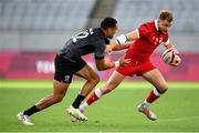 27 July 2021; Theo Sauder of Canada is tackled by Sione Molia of New Zealand during the Men's Rugby Sevens quarter-final match between New Zealand and Canada at the Tokyo Stadium during the 2020 Tokyo Summer Olympic Games in Tokyo, Japan. Photo by Stephen McCarthy/Sportsfile