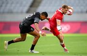 27 July 2021; Theo Sauder of Canada is tackled by Sione Molia of New Zealand during the Men's Rugby Sevens quarter-final match between New Zealand and Canada at the Tokyo Stadium during the 2020 Tokyo Summer Olympic Games in Tokyo, Japan. Photo by Stephen McCarthy/Sportsfile