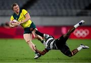 27 July 2021; Henry Hutchinson of Australia is tackled by Bolaca Napolioni of Fiji during the Men's Rugby Sevens quarter-final match between Fiji and Australia at the Tokyo Stadium during the 2020 Tokyo Summer Olympic Games in Tokyo, Japan. Photo by Stephen McCarthy/Sportsfile