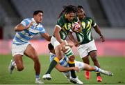 27 July 2021; Justin Geduld of South Africa is tackled by Lautaro Bazan Belez and Lucio Cinti, left, of Argentina during the Men's Rugby Sevens quarter-final match between South Africa and Argentina at the Tokyo Stadium during the 2020 Tokyo Summer Olympic Games in Tokyo, Japan. Photo by Stephen McCarthy/Sportsfile