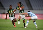 27 July 2021; Justin Geduld of South Africa is tackled by Lautaro Bazan Belez of Argentina during the Men's Rugby Sevens quarter-final match between South Africa and Argentina at the Tokyo Stadium during the 2020 Tokyo Summer Olympic Games in Tokyo, Japan. Photo by Stephen McCarthy/Sportsfile