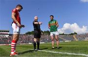 25 July 2021; Referee Barry Cassidy performs the coin toss with team captains Ian Maguire of Cork and Paul Murphy of Kerry before the Munster GAA Football Senior Championship Final match between Kerry and Cork at Fitzgerald Stadium in Killarney, Kerry. Photo by Piaras Ó Mídheach/Sportsfile