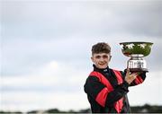 27 July 2021; Jockey Mikey Sheehy celebrates with the cup after winning the Colm Quinn BMW Mile Handicap on Sirjack Thomas during day two of the Galway Races Summer Festival at Ballybrit Racecourse in Galway. Photo by David Fitzgerald/Sportsfile