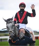 27 July 2021; Jockey Mikey Sheehy celebrates on Sirjack Thomas alongside groom Zoe Boardman after winning the Colm Quinn BMW Mile Handicap during day two of the Galway Races Summer Festival at Ballybrit Racecourse in Galway. Photo by David Fitzgerald/Sportsfile