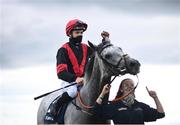 27 July 2021; Jockey Mikey Sheehy celebrates on Sirjack Thomas alongside groom Zoe Boardman after winning the Colm Quinn BMW Mile Handicap during day two of the Galway Races Summer Festival at Ballybrit Racecourse in Galway. Photo by David Fitzgerald/Sportsfile