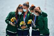 28 July 2021; Ireland rowers, from left, Aifric Keogh, Eimear Lambe, Fiona Murtagh and Emily Hegarty embrace on the podium with their bronze medals after finishing 3rd place in the Women's Four final at the Sea Forest Waterway during the 2020 Tokyo Summer Olympic Games in Tokyo, Japan. Photo by Seb Daly/Sportsfile