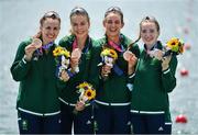 28 July 2021; Ireland rowers, from left, Aifric Keogh, Eimear Lambe, Fiona Murtagh and Emily Hegarty celebrate on the podium with their bronze medals after finishing 3rd place in the Women's Four final at the Sea Forest Waterway during the 2020 Tokyo Summer Olympic Games in Tokyo, Japan. Photo by Seb Daly/Sportsfile