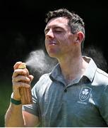 28 July 2021; Rory McIlroy of Ireland applies sunscreen spray during a practice round at the Kasumigaseki Country Club during the 2020 Tokyo Summer Olympic Games in Kawagoe, Saitama, Japan. Photo by Ramsey Cardy/Sportsfile