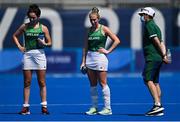 28 July 2021; Ireland players Hannah McLoughlin, left, Sarah Hawkshaw, centre, and Ireland head coach Sean Dancer after the women's pool A group stage match between Germany and Ireland at the Oi Hockey Stadium during the 2020 Tokyo Summer Olympic Games in Tokyo, Japan. Photo by Brendan Moran/Sportsfile