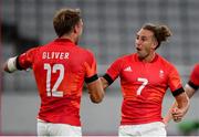 27 July 2021; Dan Bibby and Harry Glover, left, of Great Britain celebrate following the Men's Rugby Sevens quarter-final match between Great Britain and United States at the Tokyo Stadium during the 2020 Tokyo Summer Olympic Games in Tokyo, Japan. Photo by Stephen McCarthy/Sportsfile