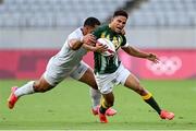 28 July 2021; Ronald Brown of South Africa is tackled by Martin Iosefo of United States during the Men's Rugby Sevens 5th placed play-off match between USA and South Africa at the Tokyo Stadium during the 2020 Tokyo Summer Olympic Games in Tokyo, Japan. Photo by Ramsey Cardy/Sportsfile