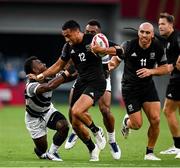 28 July 2021; Sione Molia of New Zealand is tackled by Jerry Tuwai of Fiji during the Men's Rugby Sevens gold medal match between Fiji and New Zealand at the Tokyo Stadium during the 2020 Tokyo Summer Olympic Games in Tokyo, Japan. Photo by Ramsey Cardy/Sportsfile