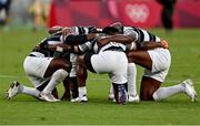 28 July 2021; Fiji players pray together following their victory in the Men's Rugby Sevens gold medal match between Fiji and New Zealand at the Tokyo Stadium during the 2020 Tokyo Summer Olympic Games in Tokyo, Japan. Photo by Ramsey Cardy/Sportsfile