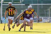 28 July 2021; Sean Cooney of Wexford in action against Jeff Neary of Kilkenny during the 2021 Electric Ireland Leinster Minor Hurling Championship Final match between Kilkenny and Wexford at Netwatch Cullen Park in Carlow. Photo by Matt Browne/Sportsfile