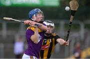 28 July 2021; Luke Murphy of Wexford in action against Sean Moore of Kilkenny during the 2021 Electric Ireland Leinster Minor Hurling Championship Final match between Kilkenny and Wexford at Netwatch Cullen Park in Carlow. Photo by Matt Browne/Sportsfile