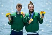 29 July 2021; Fintan McCarthy, left, and Paul O'Donovan of Ireland celebrate with their gold medals after winning the Men's Lightweight Double Sculls final at the Sea Forest Waterway during the 2020 Tokyo Summer Olympic Games in Tokyo, Japan. Photo by Seb Daly/Sportsfile