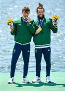 29 July 2021; Fintan McCarthy, left, and Paul O'Donovan of Ireland celebrate with their gold medals after winning the Men's Lightweight Double Sculls final at the Sea Forest Waterway during the 2020 Tokyo Summer Olympic Games in Tokyo, Japan. Photo by Seb Daly/Sportsfile
