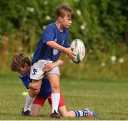 29 July 2021; Daniel Noone, age 10, in action during the Bank of Ireland Leinster Rugby Summer Camp at Blackrock RFC in Dublin. Photo by Matt Browne/Sportsfile