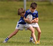 29 July 2021; Senan Flynn, age 8, and Kealan McCourt, age 8, in action during the Bank of Ireland Leinster Rugby Summer Camp at Blackrock RFC in Dublin. Photo by Matt Browne/Sportsfile