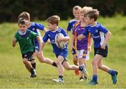 29 July 2021; Rory Micks, age 7, in action during the Bank of Ireland Leinster Rugby Summer Camp at Blackrock RFC in Dublin. Photo by Matt Browne/Sportsfile