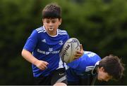 29 July 2021; Alex O'Loughlin, age 11, in action during the Bank of Ireland Leinster Rugby Summer Camp at Westmanstown RFC in Dublin. Photo by Matt Browne/Sportsfile