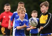 29 July 2021; Rian Mulligan, age 9, in action during the Bank of Ireland Leinster Rugby Summer Camp at Westmanstown RFC in Dublin. Photo by Matt Browne/Sportsfile